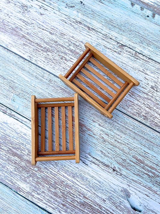 Two bamboo draining soap dishes with a slated design to create plenty of airflow to the soap bar.  Eco-friendly option for natural soap bar and soap dish.