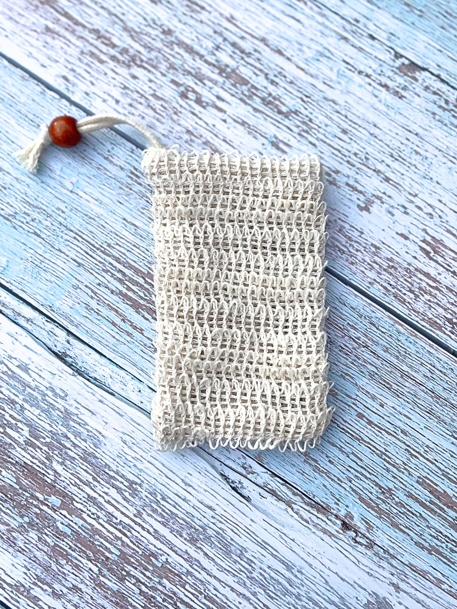 A sisal soap pouch is a eco-friendly option for storing your natural soap bar.  This beige pouch can hang in your shower for you to use with your soap bar inside. It is a natural skin exfoliant and can improve blood circulation. 
